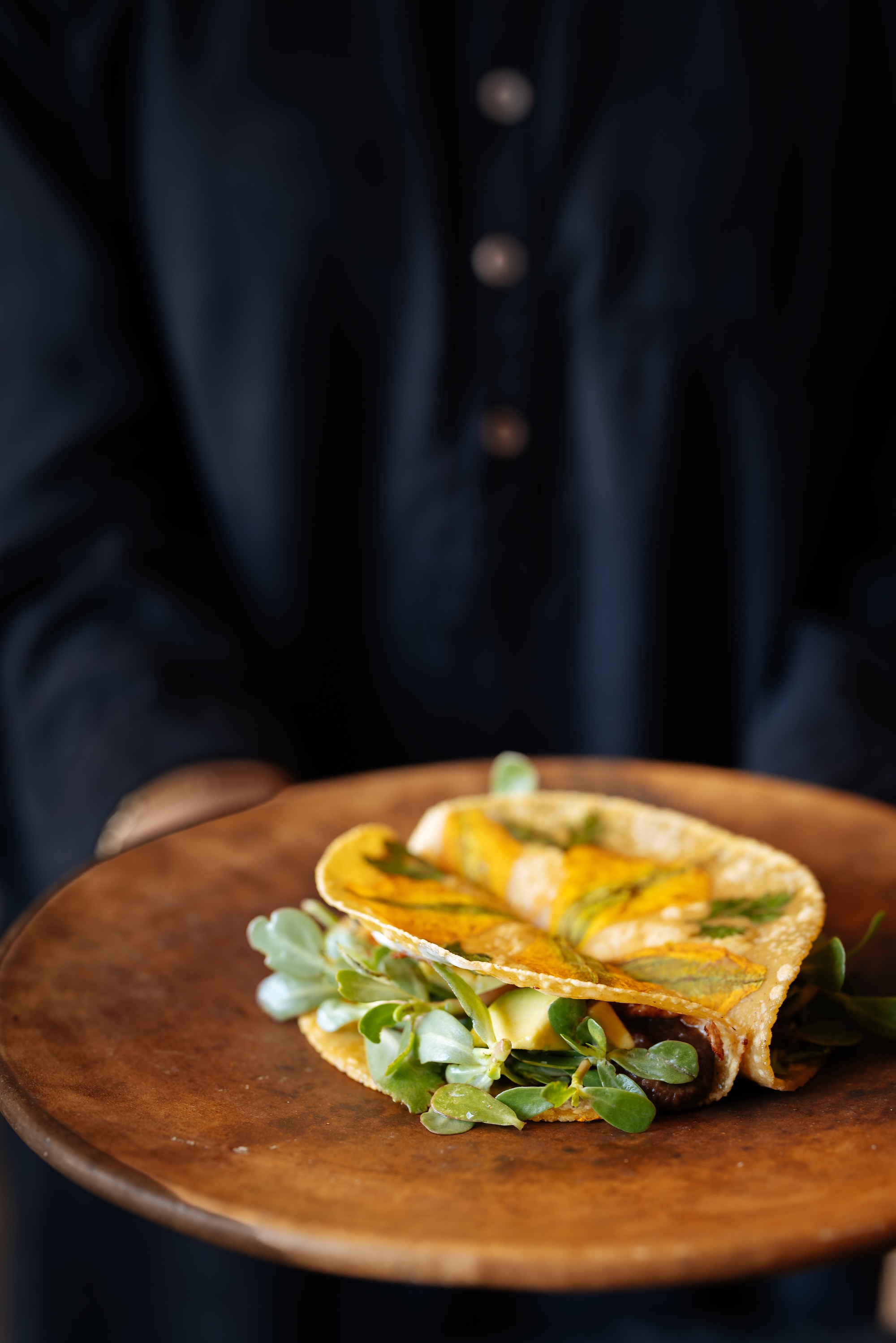 A mushroom, purslane and panela taco with zucchini-flower tortilla