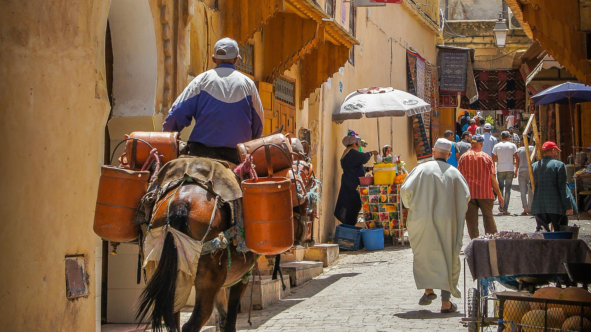 A merchant bringing his wares to market in Marrakech
